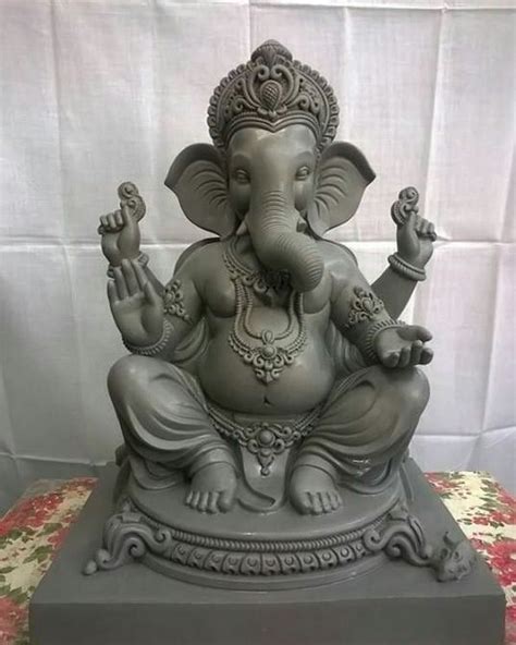 an elephant statue sitting on top of a table