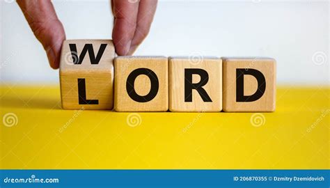 The Word of the Lord Symbol. Hand Turns the Wooden Cube and Changes the Word `Lord` To `word` on ...