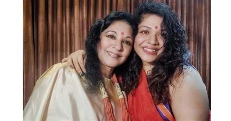 two women are posing for a photo together