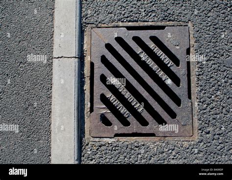 Cast iron storm drain grate Stock Photo - Alamy