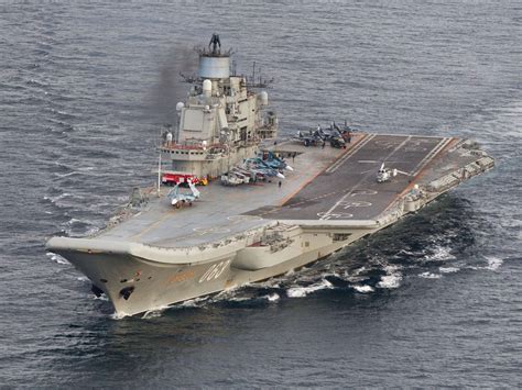 Russian naval fleet sailing towards English Channel with flagship aircraft carrier and nuclear ...