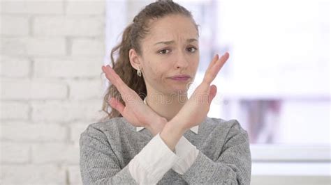 Rejecting Young Latin Woman Saying No by Hand Gesture Stock Photo ...