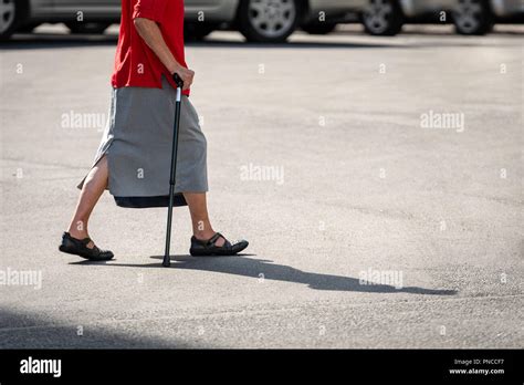 Old lady walking stick on hi-res stock photography and images - Alamy