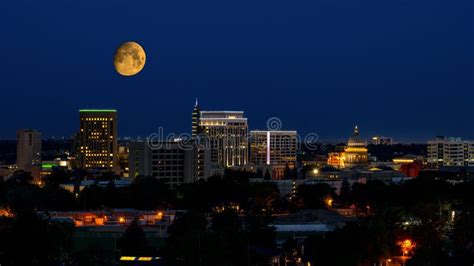 Boise City at Night with a Large Yellow Moon Over the Skyline Stock ...