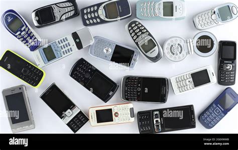 Prague, CZ- 21 January 2021: Heap of Various brand old mobile phones. various types and ...