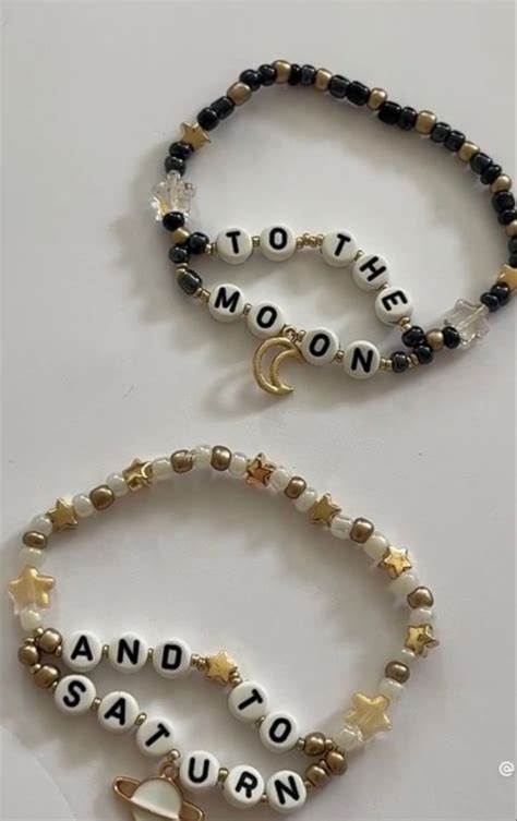 two bracelets with words written on them and charms attached to the beads that spell out mother ...