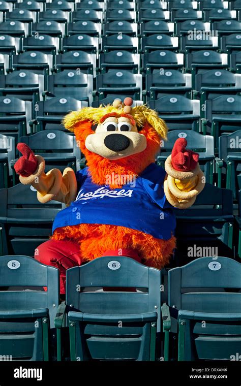 Orbit (Isotopes Baseball Team mascot) in stadium seats flashing No. 1 ...