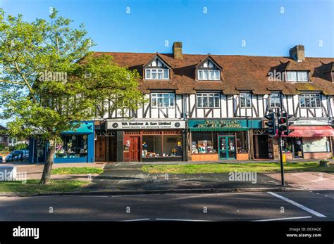 Parade of shops on Banstead village High Street, on a quiet Sunday morning in Surrey, England ...