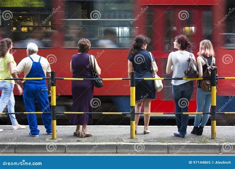 People at bus stop editorial image. Image of sidewalk - 97144865