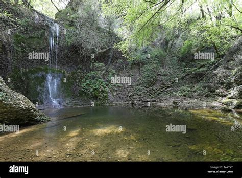 fascinating waterfall created by a mountain stream Stock Photo - Alamy