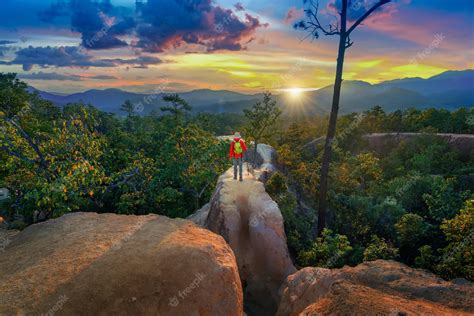 Premium Photo | Young man trekking along pai canyon in mae hong son province, thailand ...