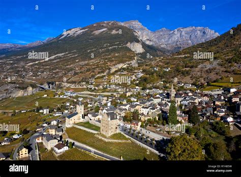 Drone image, Leuk-Stadt, bishop's palace with glass dome by Mario Botta, left, and gothic town ...