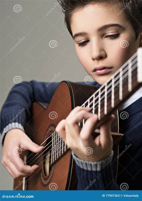 Caucasian Boy Playing on Acoustic Guitar. Stock Image - Image of teenager, teen: 77907363