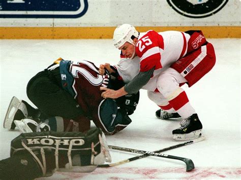 The Colorado Avalanche's Claude Lemieux and Red Wings' Darren McCarty fight at Joe Louis Arena ...