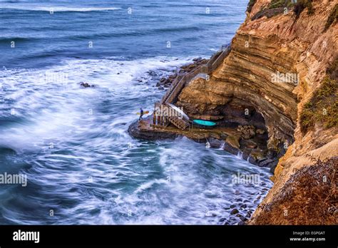 Looking down on stairs leading down a cliff to a surfing spot. Sunset Cliffs Natural Park, San ...