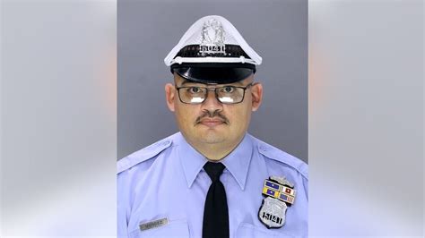 Philadelphia policeman released from hospital as search continues for ...