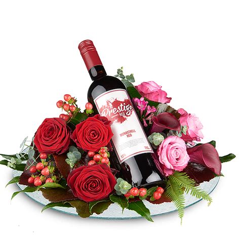 Flower arrangement with Red prestige wine order and deliver - Topbloemen.nl