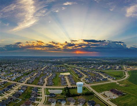 Sun rays over marion iowa Photograph by Christopher V Sherman - Fine Art America