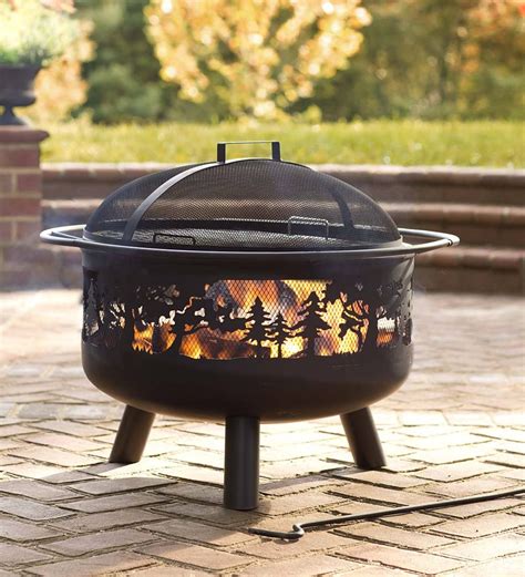 Sturdy, stylish and affordable, our Timberline Fire Pit features a cutout forest design backed ...