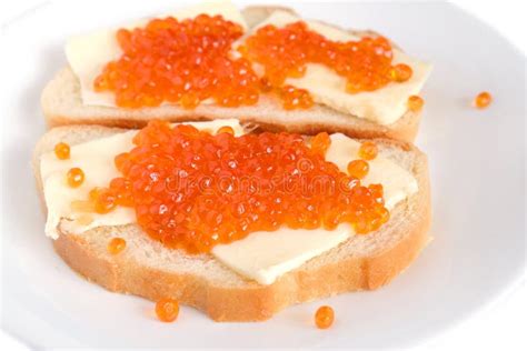 Sandwiches With Butter And Red Caviar On White Bread Lies On A Round ...