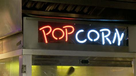 Movie Theatre Commercial Popcorn Machine With A Neon Sign That Says "POPCORN". Stock Footage ...