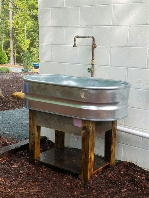 Stock tank sink. Pallet wood base. | Garden sink, Outdoor sinks, Diy ...