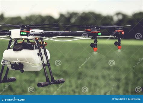 Closeup View of Agriculture Drone Spraying Water Fertilizer on the Green Field Stock Image ...