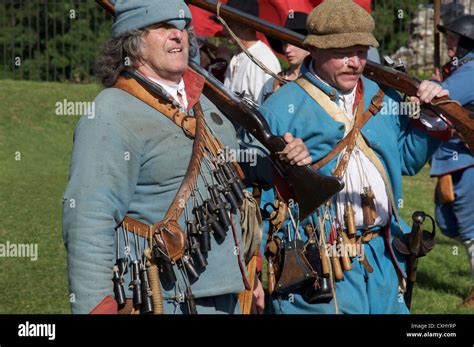 English Civil War reenactors in the uniform of Royalist musketeers at a ...