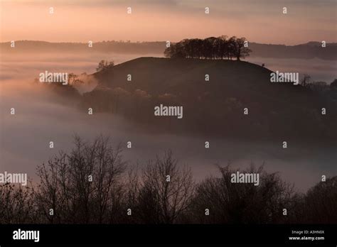 Downham Hill shrouded in mist from Uley Bury on the Cotswold Way, Gloucestershire, GB Stock ...