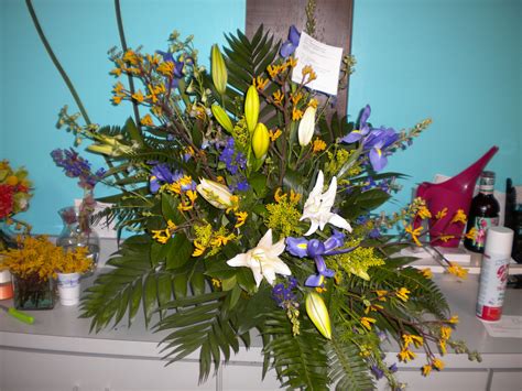 White, yellow and blue funeral arrangement. Funeral Arrangements ...