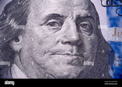 Shot of the US One Hundred dollar bill with focus on Benjamin Franklin Stock Photo - Alamy