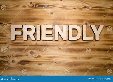 FRIENDLY Word Made with Building Blocks on Wooden Board Stock Photo ...