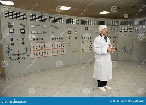 Worker Standing in Front of Main Control Board in a Control Operations ...