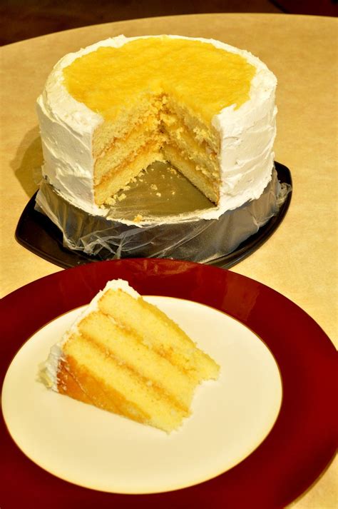 Pineapple Buttercream cake and slice. Cake has a homemade pineapple filling between the layers ...