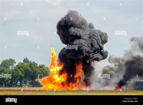 Large explosion with black smoke Stock Photo - Alamy