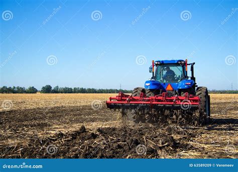 Tractor Work the Land on a Farm Stock Image - Image of harvest, mirror ...