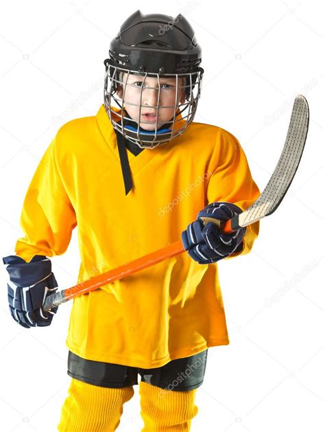 Cute boy in yellow hockey uniform — Stock Photo © sandman86 #10584338