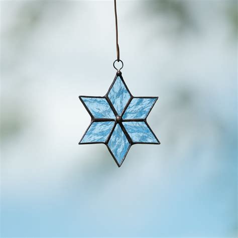 Snowflake window hanging of stained glass for Christmas holidays