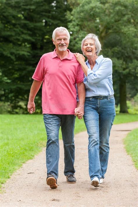 Walking in the park stock image. Image of seniors, senior - 26265783