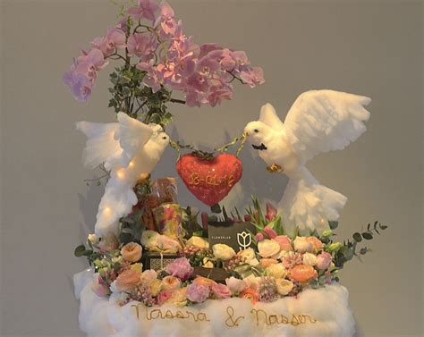 Cotton love birds with gifts in flower arrangement | Bird wedding, Love birds wedding, Love birds