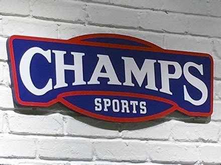 Champs Sports® White-Washed Window Branding - Fixtures Close Up