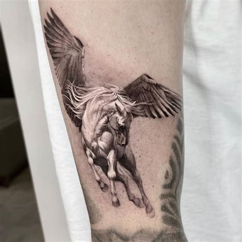 Micro-realistic Pegasus tattoo located on the upper