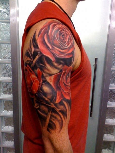 Realistic red rose flowers tattoo for men on upper arm - Tattooimages ... | Men flower tattoo ...