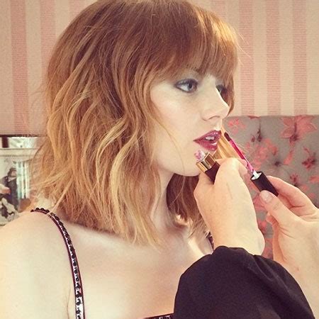 Look We Love: Emma Stone's New Bangs and Glossy Berry Lips | Allure