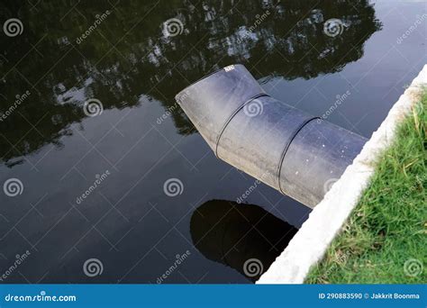 A Big Black Metal Drain Pipe To the Canal in the Park for Drain Water, Environment Concept Stock ...