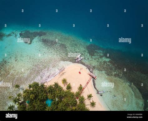 Beach on coral island aerial above view Stock Photo - Alamy