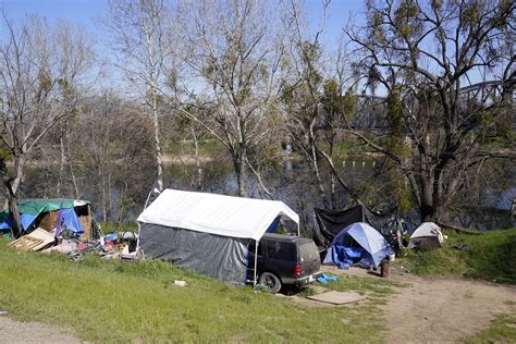 California bill aims to remove homeless from river parkways | AP News