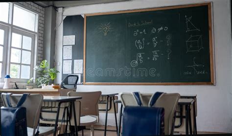 Empty Classroom with Chairs Elementary School Desks and Chalkboard ...