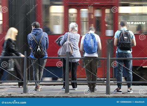 People waiting at bus stop editorial photo. Image of routine - 130806666