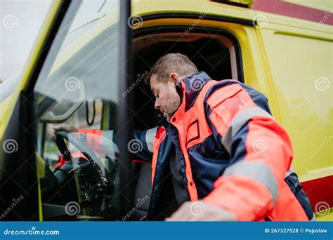 Rescuer Getting in To Ambulance Car, Preparing for Rescue Operation ...